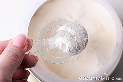 White protein powder in jar Stock Photo