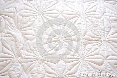 close up of white quilted bedding top view Stock Photo