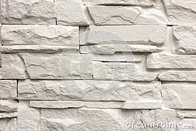 Close-up of white solid limestone wall or stone fence. Abstract copy space background, Bricklaying, construction and masonry Stock Photo