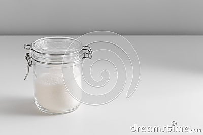 close up of white sugar glass jar on table Stock Photo