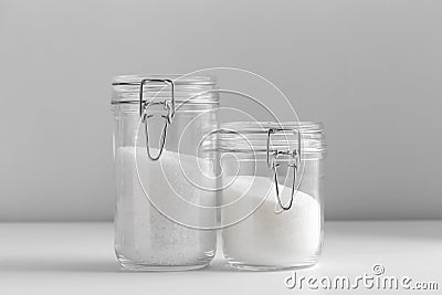 close up of white sugar and salt glass jars Stock Photo