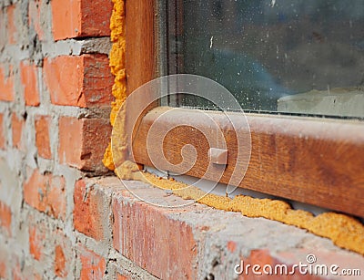 Close up on window insulation with foam. Stock Photo