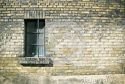 Close up of a window on weatherd brick wall Stock Photo