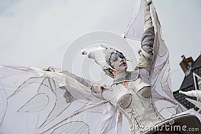 Close up of winged woman who is part of the street theater group Close-Act Editorial Stock Photo