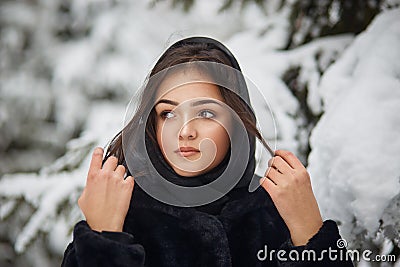 close up winter portrait of dreamy young woman Stock Photo
