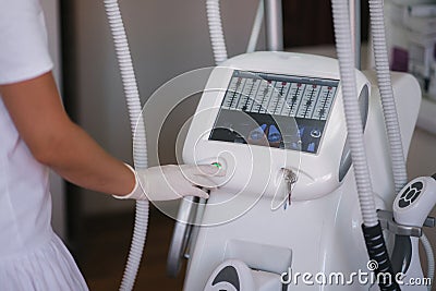 Close up of womam turn on medical laser Stock Photo