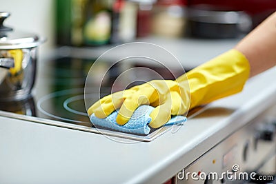 Close up of woman cleaning cooker at home kitchen Stock Photo