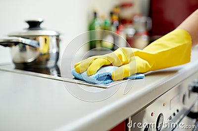 Close up of woman cleaning cooker at home kitchen Stock Photo