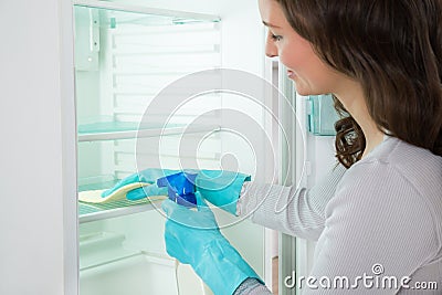 Close-up Of Woman Cleaning Fridge Stock Photo
