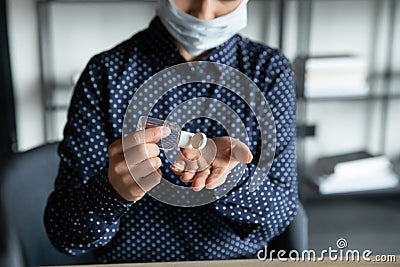 Close up of woman disinfect hands with sanitizer Stock Photo