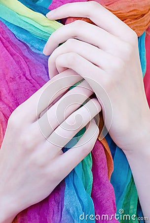 Close up of woman elegant thin hands long fingers holding scarf Stock Photo