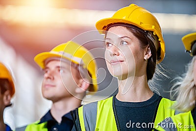 Close up woman engineer, Team engineering worker technician, workshop manufacturing, Teamwork in industry factory. group Stock Photo