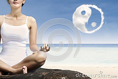 Close-up woman exercise yoga at beach Stock Photo