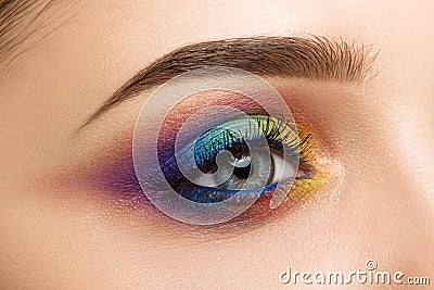 Close-up of woman eye with beautiful colourful makeup Stock Photo