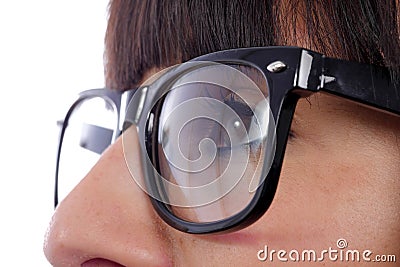 Close-up of a woman eye with black glasses Stock Photo