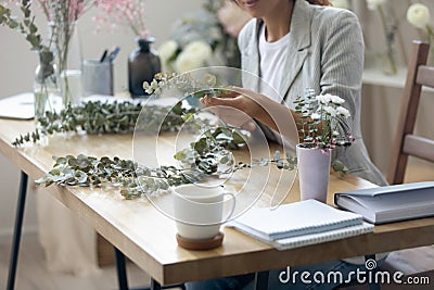 Close up of woman florist compose house decorations Stock Photo