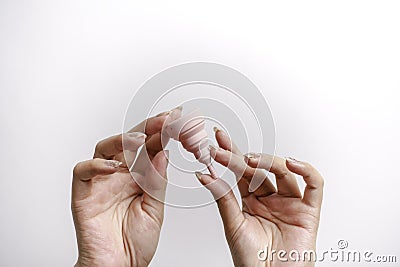 Close up of woman hand holding menstrual cup over white background. Women health concept, zero waste alternatives Stock Photo