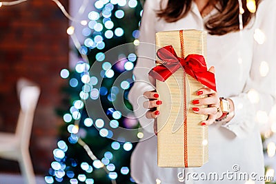 Close up on woman hands giving Christmas present. Stock Photo