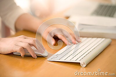 Close up of woman hands using mouse and keyboard. Stock Photo