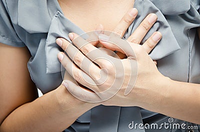 Close up woman having chest pain breast pain Stock Photo