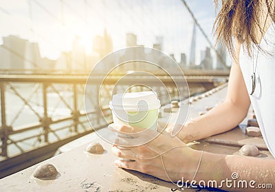 Close up on a woman holding coffee paper cup Stock Photo