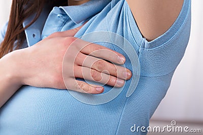 Woman Sweating Very Badly Under Armpit Stock Photo