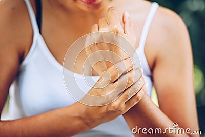 Close up Woman Left wrist pain Stock Photo