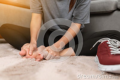 Close up woman massaging her pain of foot Stock Photo