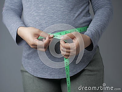 Measuring Waistline With Measurement Tape Stock Photo