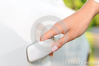 Close up of woman opening car Stock Photo