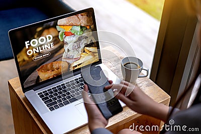 Close up woman ordering food online by internet Concept order Stock Photo