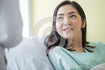 Close up woman patient listen carefully to doctor advice on hospital bed. Stock Photo