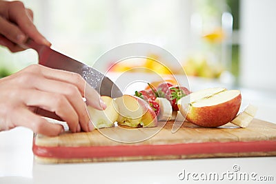 Close Up Of Woman Preparing Fruit Salad Stock Photo