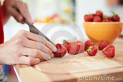 Close Up Of Woman Preparing Fruit Salad Stock Photo