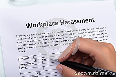 Woman Filling Workplace Harassment Form Stock Photo