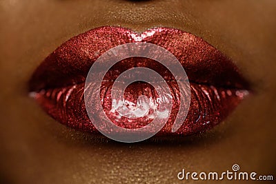 Close-up of woman's lips with bright fashion dark red glossy makeup. Macro lipgloss cherry make-up. kiss Stock Photo