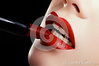 Close-up of woman`s lips with fashion red make-up. Beautiful female mouth, full lips with perfect makeup Stock Photo