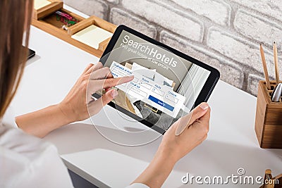 Woman Searching Online Hotels Stock Photo