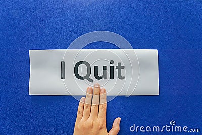 Woman submit resignation letter to quit the job with blue background Stock Photo