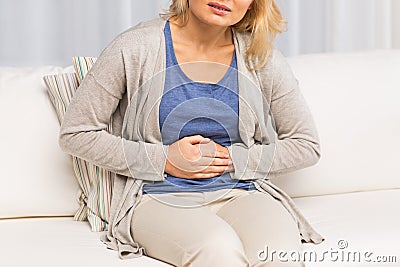 Close up of woman suffering from stomach ache Stock Photo