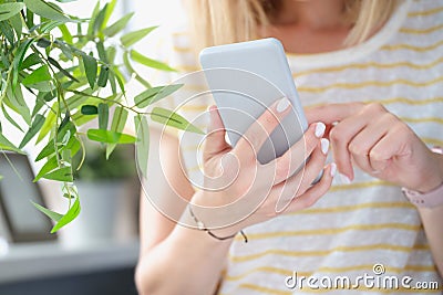 Woman texting on mobile phone or playing online game to kill time Stock Photo