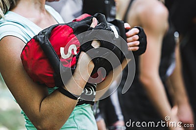 Close-up of woman training at crossfit center with sandbag Stock Photo