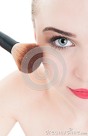 Close-up with woman using make-up brush Stock Photo