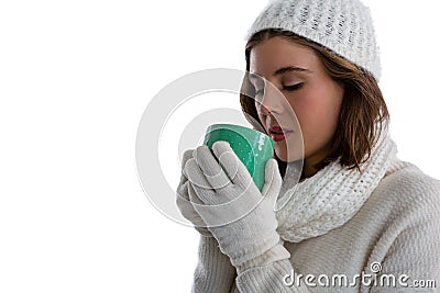 Close up of woman in warm clothing having coffee Stock Photo