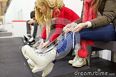 Close up of woman wearing skates on skating rink Stock Photo