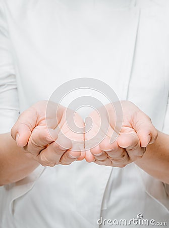 Close up of womans cupped hands Stock Photo