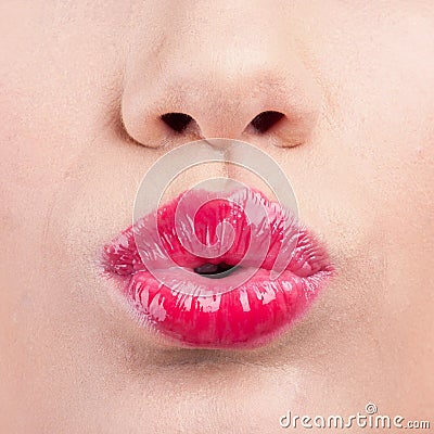 Close up of womans pouting lips with lipstick Stock Photo