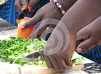 Close-up of women`s hands chopping vegetables Stock Photo