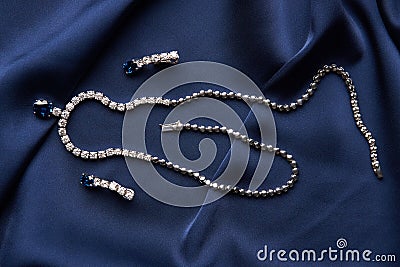 Close-up of women`s platinum necklace and earrings Stock Photo