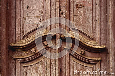 Close-up Wooden ancient Italian door in the historic center. Old European architecture. Two-fold wooden carved door Stock Photo